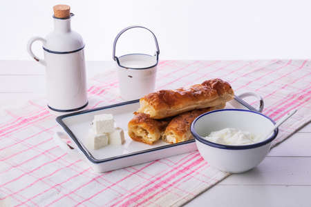 Baked cheese pie with milk. Bulgarian butter banitsa for breakfastの写真素材