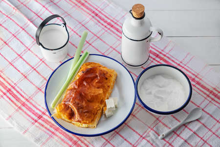 Baked cheese pie with milk. Bulgarian butter banitsa for breakfastの写真素材