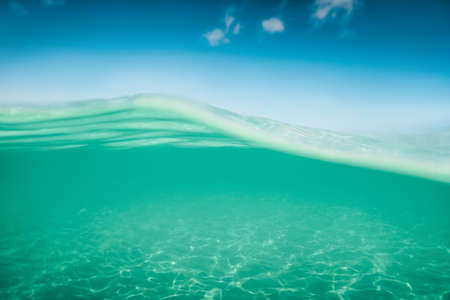 Sea sand and blue water. Underwater. ocean background.