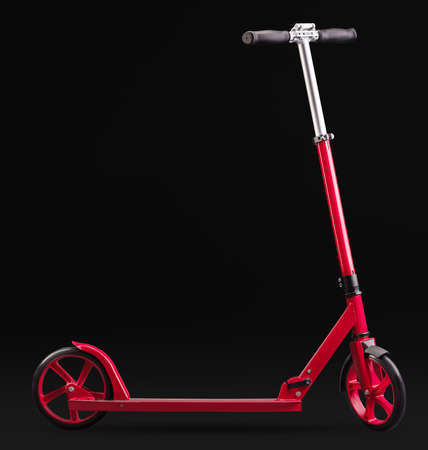 Red modern scooter studio isolated on black background with clipping pathの写真素材