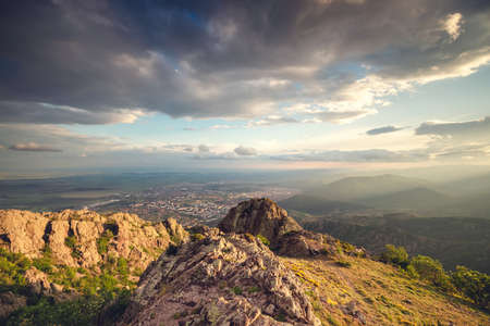 Sunset over the mountain hills and Sliven city, aerial panoramic viewの写真素材