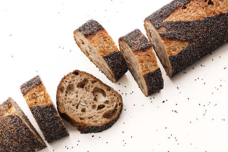 Homemade sourdough bread baguette on white beackground. Top view.