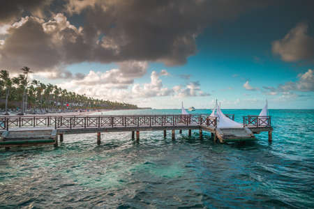 Aerial view of tropical wooden pier and turquoise caribbean sea in Punta Cana, Dominican Republicの写真素材