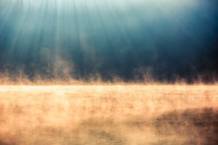 Morning fog on the lake, sunrise shotの写真素材