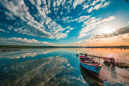 Small Dock and Boat at the lakeの写真素材