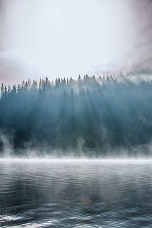 Morning fog on the lake, sunrise shotの写真素材