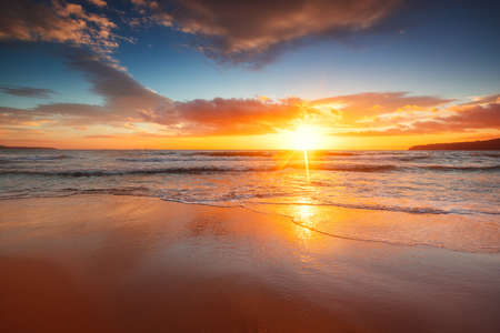Beach sunrise over the tropical seaの写真素材