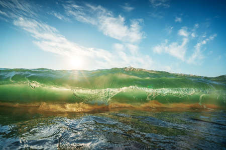 Beautiful green sunrise waveの写真素材