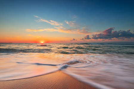 Beautiful cloudscape over the sea, sunrise shotの写真素材