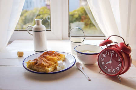 Baked cheese pie with milk. Bulgarian butter banitsa for breakfastの写真素材