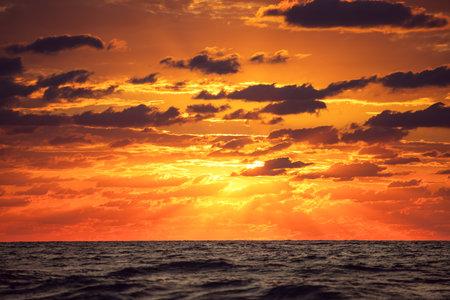 Dramatic cloudscape over the sea, sunrise shotの写真素材