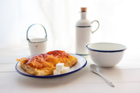 Baked cheese pie with milk. Bulgarian butter banitsa for breakfastの写真素材