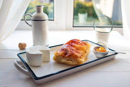 Baked cheese pie with milk. Bulgarian butter banitsa for breakfastの写真素材