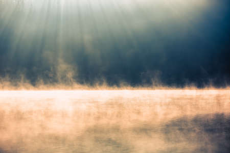 Morning fog on the lake, sunrise shotの写真素材
