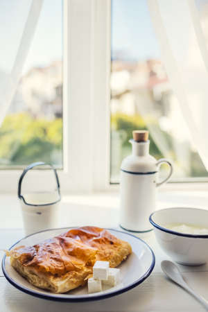 Baked cheese pie with milk. Bulgarian butter banitsa for breakfastの写真素材