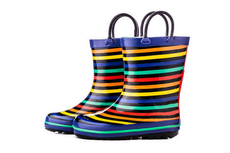 Colorful kids rubber boots for rain isolated on white background.の写真素材
