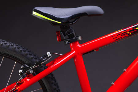 Sport mountain red bicycle isolated on black backgroundの写真素材