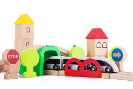 Wooden train and railway road educational toys for kids on white backgroundの写真素材