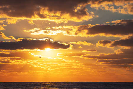 Beautiful cloudscape over the sea, sunrise shotの写真素材