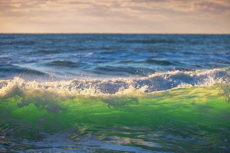 Beautiful green sunrise waveの写真素材