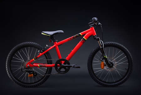 Sport mountain red bicycle isolated on black backgroundの写真素材