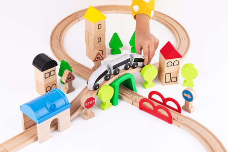 Wooden train and railway road educational toys for kids on white backgroundの写真素材