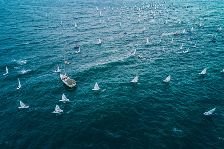 VARNA, BULGARIA , October 05, 2021: Sailing regatta in the open sea. Sailing boat compete for the regatta Varna Senior Sailing European Championshipsのeditorial素材