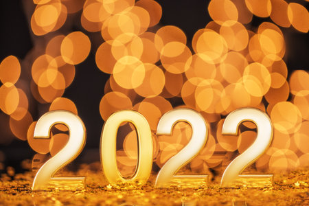 Happy New Year 2022 with gold lights bokeh background.の写真素材