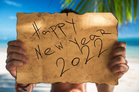 Happy new year 2022 concept with Tourist on tropical island beach. Punta Cana, Dominican Republic.の写真素材