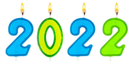 2022 Happy new year burning party candles isolated on white.の写真素材