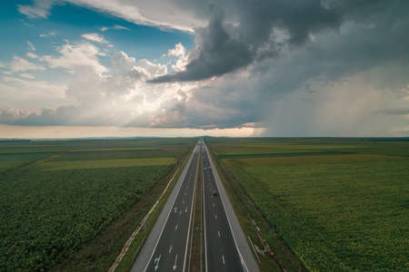 Driving on open road at beautiful cloudy day.Aerial viewの写真素材