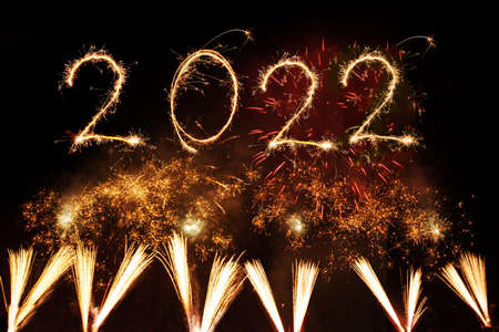 2022 Happy New Year written with Sparkle firework on black background,の写真素材