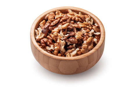 Organic raw walnuts in wooden bowl isolated on white background.の写真素材