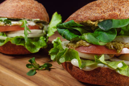 Healthy Vegan Burger. Hamburgers on a wooden table.の写真素材