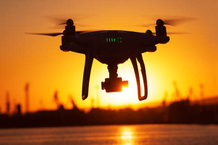 Flying Drone and sunsetの写真素材