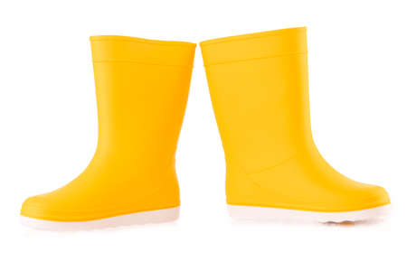 Yellow rubber boots isolated on white background. Kids shoes.の写真素材