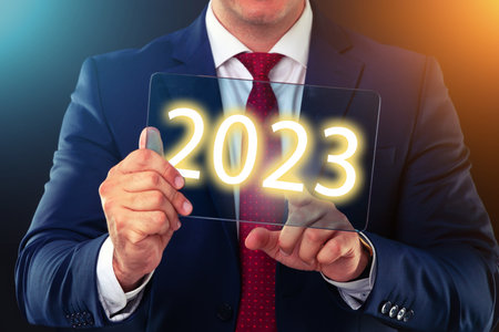 Businessman working with future technology screen, new year 2023 finance concept.の写真素材