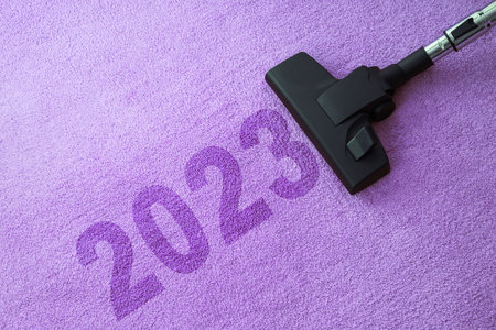 2023 New year home cleaning with vacuum cleaner and copy space for a textの写真素材