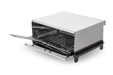 Electric party grill or roaster oven for sandwiches, steaks or sausages isolated on white backgroundの写真素材