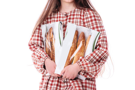 Girl baker in vintage dress serving freshly baked homemade bread rolls with cheeseの写真素材