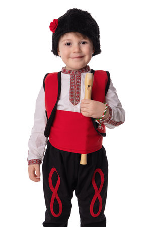 Bulgarian boy in traditional folklore costumes with spring flowers snowdrop and handcraft wool bracelet martenitsa symbol of Baba Martaの写真素材