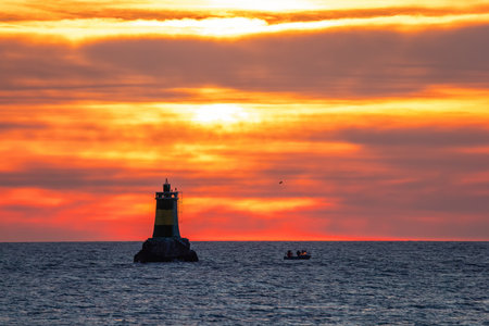Boat and sunrise, beautiful cloudscapeの写真素材