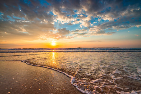 Beach sunrise over the tropical seaの写真素材