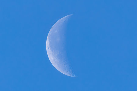 Blue sky with moonの写真素材