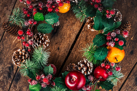 Christmas Wreath on wooden background. Christmas Home Decoration with copy space for text