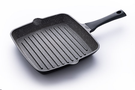 Modern stone and aluminium pan for frying and cooking of vegetable, fish and meat steak, stainless steel frying pan isolatedの写真素材