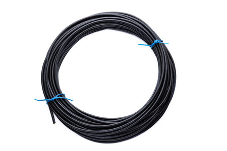 Black wire cooper cable isolated on a white background.の写真素材