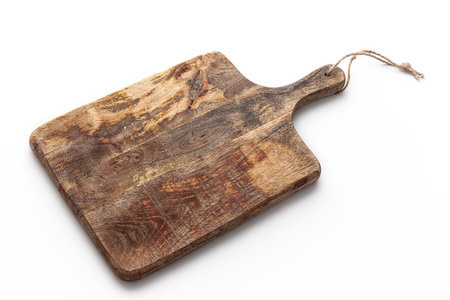Cutting board. Old, vintage, wooden chopping board isolated on white background.の写真素材