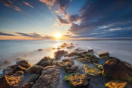 Beautiful cloudscape over the sea, sunrise shotの写真素材