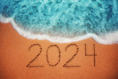 Happy New Year 2024 concept, lettering on the beach. Sea sunrise.の写真素材